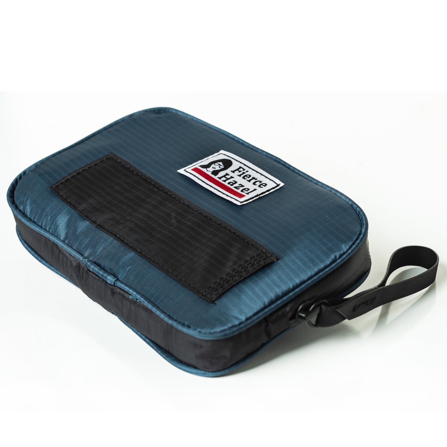Angled, front view of the world's lightest cycling ride wallet. Ultra-lightweight, weather-proof, made from deadstock. Works as a phone case and travel wallet