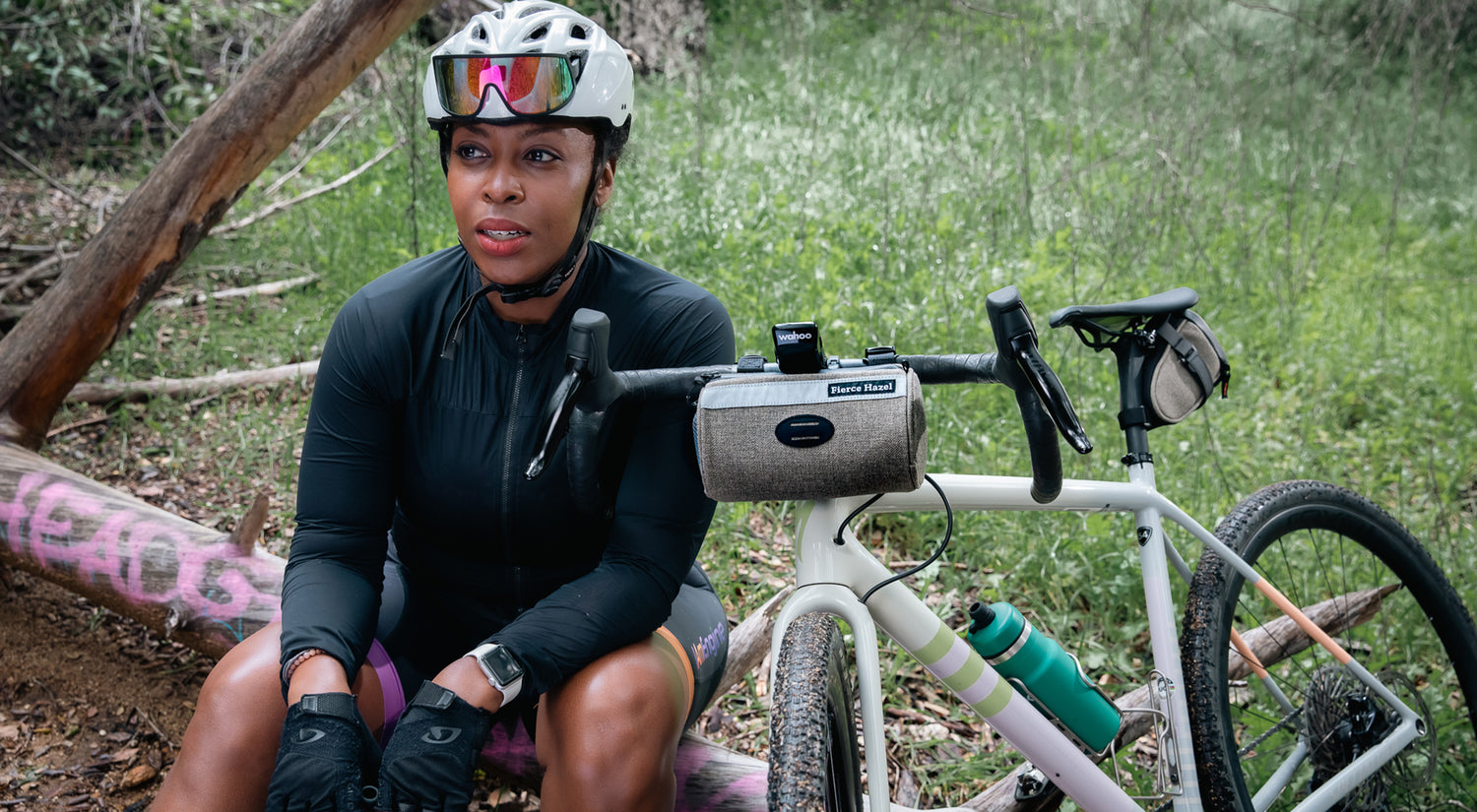 Black woman cyclist sitting with Fierce Hazel True Grit Handlebar Bag