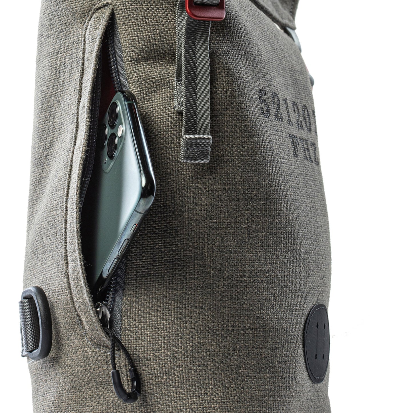Phone zipper pouch on a Fierce Hazel gender-neutral shoulder bag and convertible backpack. Sling pack and camera bag